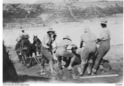 2nd Squadron Field Engineers scooping a river bank with a wheel rim, near Gaza 1917. Photo source AWM H02644