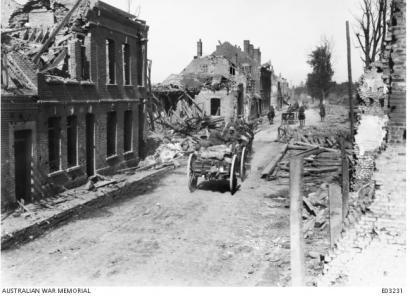 Australian FAB passing through the streets of Peronne, France. Photographer unknown, photograph source AWM E03231