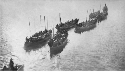 Australian Troops being towed ashore at Gallipoli. Photographer R.M. Bowman photograph source AWM P2194.005