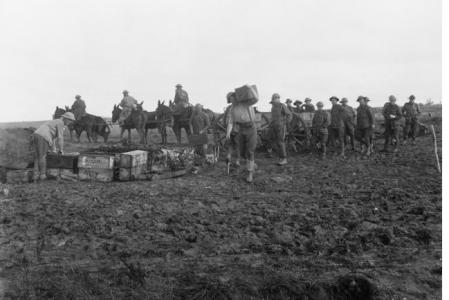 Carrying ammunition to the Australian Artillery front line, the day prior to the Battle of Amiens 7.8.1918 . Photographer unknown, photograph source E02849