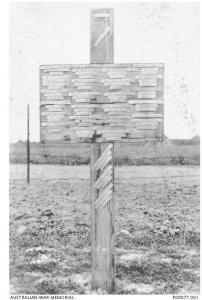 Cross marking graves unknown in the Quean British Cemetery, Nord Pas de Calais, Buissy, France.  Photographer unknown, photograph source AWM P09077.001