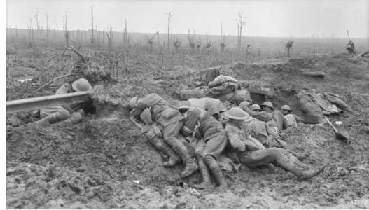 Exhausted stretcher bearers Zonnebeke 1917. Photographer unknown, photograph source AWM E00976