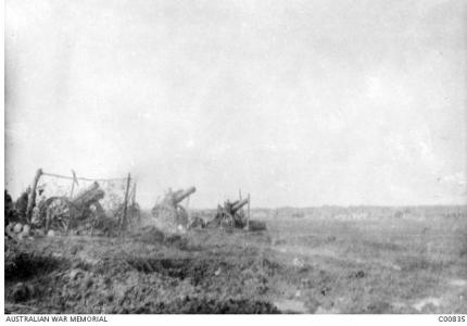 Firing at Passendaele Ridge 1917. Photographer E.C. Barnes, photograph source AWM C00835