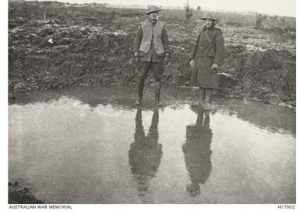 Frozen, waterfilled shell crater , Wytschaetes Ridge, Messines 1917. Photograph sourced AWM H17002