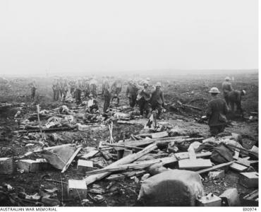 German prisoners carrying in the wounded to Regimental First Aid Post near Clapham Junstion. Photographer unknown, photograph source AWM E00974