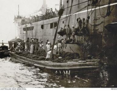 HMAT &#039;Chilka&#039; coaling up in Colombo, Ceylon 1915. Photographer unknown, photograph source  AWM H0322
