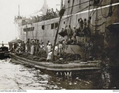 HMAT 'Chilka' coaling up in Colombo, Ceylon 1915. Photographer unknown, photograph source  AWM H0322