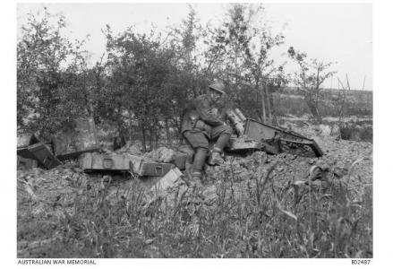 Major A. M. Phillips beside a trench mortar captured by the 11th Bn. at Mont de Merris, June 1917. Photographer unknown, photograph source AWM E02487