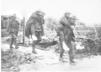 Men of the 14th AFA carrying soldiers with trench feet, Dec. 1916. Photographer unknown, photograph source AWM E00081