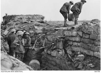 Signal engineers laying cable on Westhoek Ridge during the Battle of Zonnebeke September 26th 1917. Photographer unknown, photograph source AWM E00798