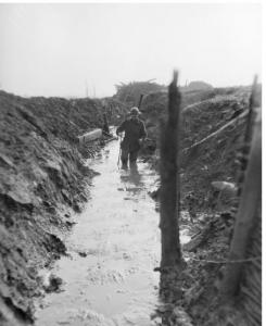 Soldier walking in winter trench 1917. Photographer unknown, photograph source AWM E01497