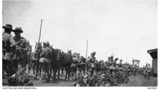 Tenth Light Horse awaiting embarkation at Fremantle wharf. Photographer unknown, photograph source AWM H02008