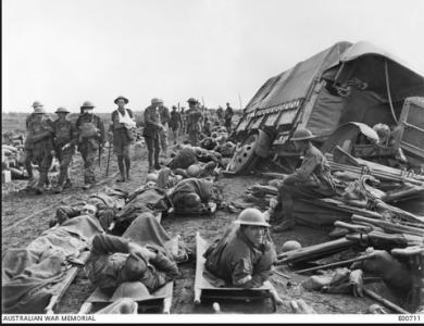 Wounded soldiers waiting to be taken to the Casualty Clearing Station France. Photographer unknown, photograph source AWM  E00701
